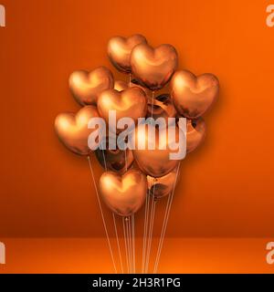 Copper heart shape balloons bunch on a white wall background ...