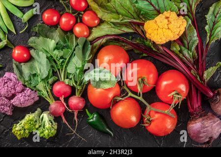 Fresh vegetables, top flat lay shot on a dark background Stock Photo