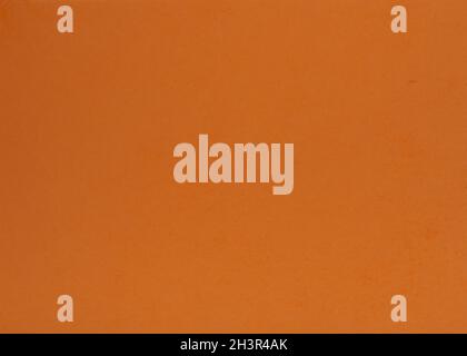 Old orange paper background. Bright orange decorative surface. Stock Photo