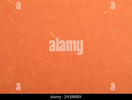 Orange textured paper background. Bright orange decorative surface. Stock Photo