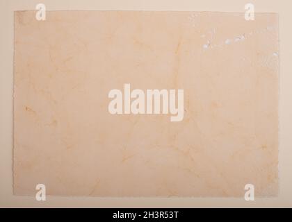 Old vintage paper background. Textured grunge surface. Stock Photo
