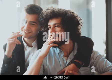 Portrait of multiethnic diverse gay LGBT romantic male couple embracing and showing their love Stock Photo