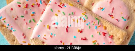 Pop tart panoramic header, a close-up of strawberry toaster pastry Stock Photo