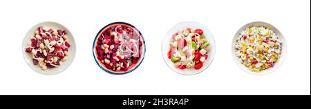 Collage of plates with various salads isolated on white background. Top view, flat lay Stock Photo
