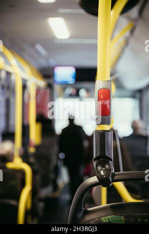 Red stop button in a bus, commuting, public transport Stock Photo