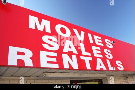Movie Rental Sign on Convenience Store Stock Photo