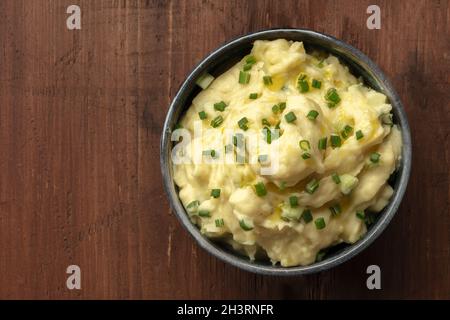 Pomme puree, a photo of a bowl of mashed potatoes with scallions Stock Photo