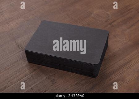Black business cards mockup on a rustic background Stock Photo