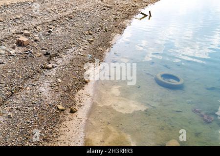 Concept for drawing attention to anthropogenic pollution in seas and lakes. Environmental pollution concept. Stock Photo