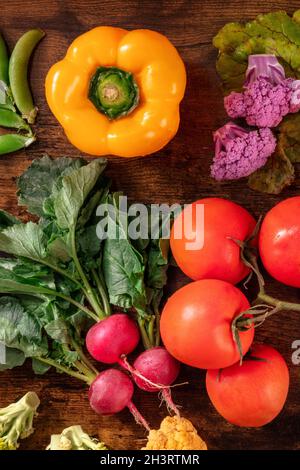 Fresh vegetables, shot from above on a dark rustic wooden background Stock Photo