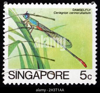 SINGAPORE - CIRCA 1985: a stamp printed in Singapore shows damselfly, cerlagrion cerinorubellum, insect, circa 1985 Stock Photo