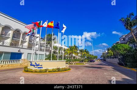 Playa del Carmen 17. April 2021 Flags of many countries like argentina spain united states canada italy and europe with blue sky at Panama Jack Resort Stock Photo