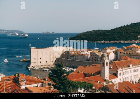 The old port harbor is porporela, near the walls of the old town of Dubrovnik, Croatia. View of the fort on the wall, Lokrum isl Stock Photo