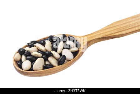 Mixed black and white kidney beans in wooden spoon isolated on white Stock Photo
