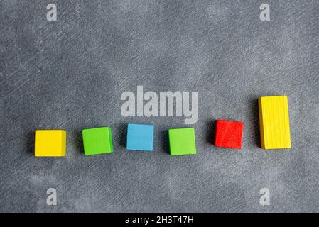 Sample Cube Rectangular Boxes Polished With Multi-Colour Symbolizing Stability Growth Development Aligned On Surface With Differ Stock Photo