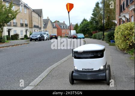A Starship Robot in Oxley Park area of Milton Keynes, Britain's first  autonomous delivery service which provides contactless delivery solutions run b Stock Photo