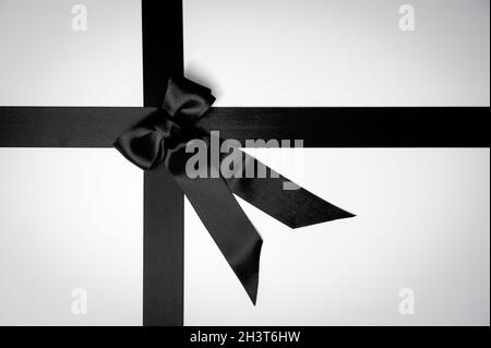 Black Friday or mourning concept with black tied ribbon bow Stock Photo