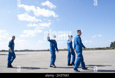 Cape Canaveral, USA. 30th Oct, 2021. NASA astronauts Tom Marshburn, left, Raja Chari, second from left, Kayla Barron, second from right, and ESA (European Space Agency) astronaut Matthias Maurer, right, are seen as they depart the Landing Facility at NASAâs Kennedy Space Center ahead of SpaceXâs Crew-3 mission, Tuesday, Oct. 26, 2021, in Florida. NASAâs SpaceX Crew-3 mission is the third crew rotation mission of the SpaceX Crew Dragon spacecraft and Falcon 9 rocket to the International Space Station as part of the agencyâs Commercial Crew Program. Chari, Marshburn, Barron, Maurer are s Stock Photo