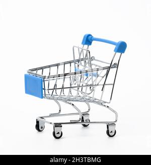 Empty miniature metal shopping cart isolated on white background Stock Photo