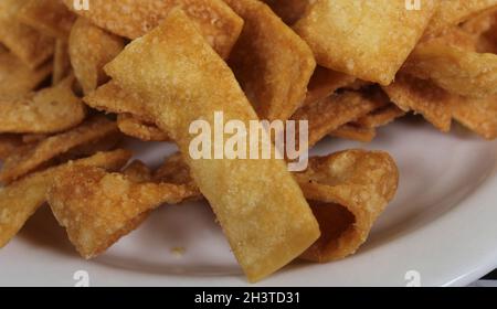 Fried Chinese Wonton Snack Chips Served in Asian Restaurant Stock Photo