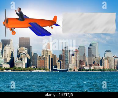 Old vintage airplane with banner ribbon Stock Photo