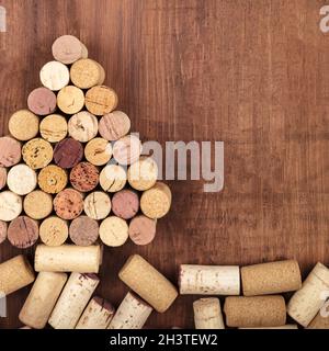 A Christmas tree made of wine corks on a dark rustic wooden background Stock Photo