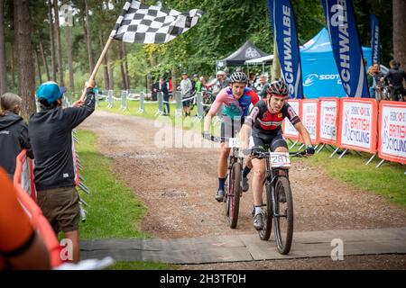 Mountain bike racers in national points series race, Cannock Chase, Staffordshire, England, UK, GB, Europe. Stock Photo