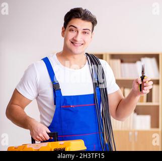 Man doing electrical repairs at home Stock Photo