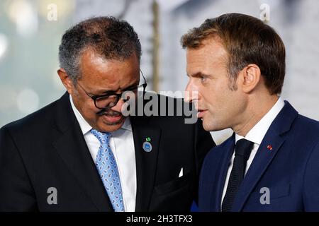 Rome, Italy. 30th Oct, 2021. Director General, World Health Organization (WHO), Tedros Adhanom Ghebreyesus (L) speaks with French President Emmanuel Macron at the start of the G20 Summit at the convention center 'La Nuvola' in the EUR district of Rome on October 30, 2021. - Never has climate change figured so prominently on the G20 agenda, and never have leaders hopped straight from a G20 to a climate summit: more than 120 heads of state and government are expected at the outset of COP26 in Scotland. Photo by Ludovic Marin/Pool/ABACAPRESS.COM Credit: Abaca Press/Alamy Live News Stock Photo