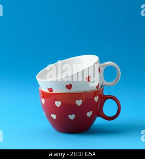 Empty ceramic cup on blue background Stock Photo