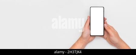 Smart phone isolated. Modern smartphone with blank screen, wide image with copy space Stock Photo