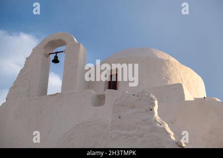 Cyclades, Greece. Mykonos island Panagia Paraportiani church, Whitewashed chapel, Greek Orthodox Christian religion landmark in Chora town. Cloudy blu Stock Photo