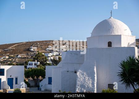 Folegandros island, Greek Orthodox church whitewashed dome at Chora town. Greece, Cyclades. Old chapel, clear blue sky background. Stock Photo