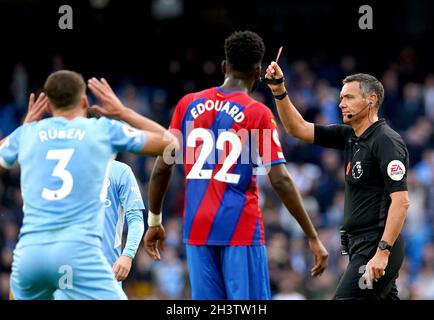 Referee Andre Marriner shows a red card to Manchester City's Aymeric Laporte (not pictured) during the Premier League match at the Etihad Stadium, Manchester. Picture date: Saturday October 30, 2021. Stock Photo