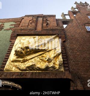 Golden relief Der Lichtbringer by Bernhard Hoetger, Boettcherstrasse, Bremen, Germany, Europe Stock Photo