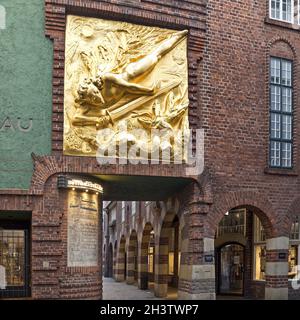 Golden relief Der Lichtbringer by Bernhard Hoetger, Boettcherstrasse, Bremen, Germany, Europe Stock Photo