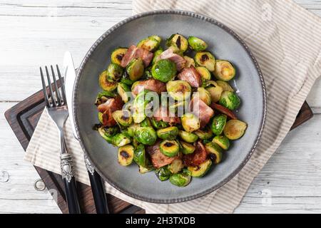 Fried Brussels sprouts with bacon Stock Photo