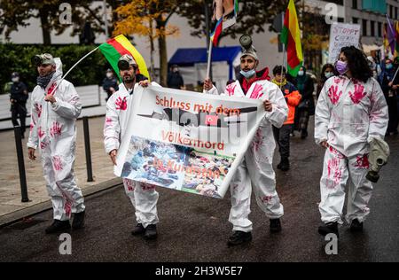 Stuttgart, Germany. 30th Oct, 2021. 'Stop the genocide in Kurdistan' is written on a banner carried by Kurdish supporters at a demonstration in downtown Stuttgart. They are demonstrating against the Turkish military operation in northern Iraq. Credit: Christoph Schmidt/dpa/Alamy Live News Stock Photo