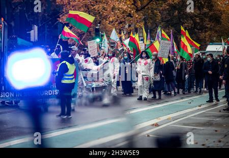 Stuttgart, Germany. 30th Oct, 2021. Supporters of the Kurds walk through downtown Stuttgart during a demonstration. They are demonstrating against the Turkish military deployment in northern Iraq. Credit: Christoph Schmidt/dpa/Alamy Live News Stock Photo
