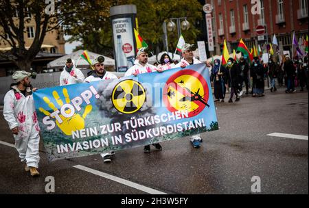 Stuttgart, Germany. 30th Oct, 2021. Kurdish supporters walk through downtown Stuttgart during a demonstration. They are demonstrating against the Turkish military deployment in northern Iraq. Credit: Christoph Schmidt/dpa/Alamy Live News Stock Photo