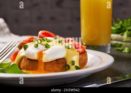 Eggs Benedict with salmon and hollandaise sauce Stock Photo