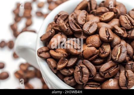 Roasted coffee beans in a cup Stock Photo