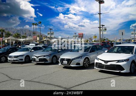Car Rental vehicles parked at Palm Springs International Airport, California Stock Photo