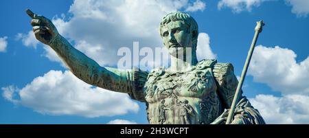 The roman emperor Gaius Julius Caesar statue in Rome, Italy. Concept for authority, domination, leadership and guidance. Stock Photo