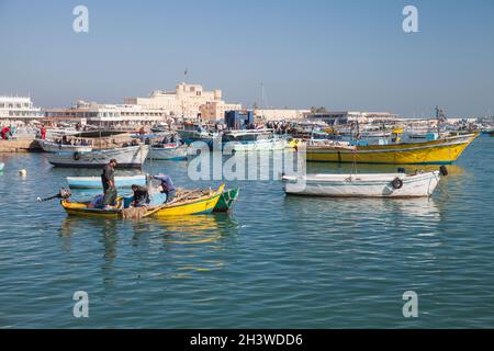 Alexandria, Egypt - December 14, 2018: Fishermen are in a boat in old fishing harbor of Alexandria Stock Photo