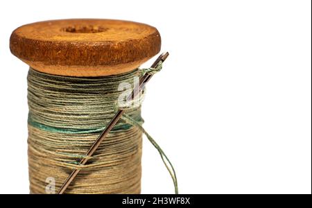 Vintage Thread And Needles On The Old Wooden Background Stock Photo,  Picture and Royalty Free Image. Image 26744924.