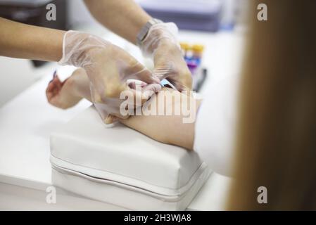Young patient during blood test sampling procedure Stock Photo