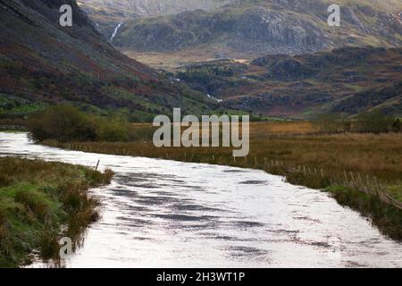 Shown here is the River Ogwen after heavy rain in Nant Ffrancon (Ogwen Valley) in Snowdonia, North Wales. Stock Photo