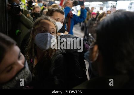 Glasgow, UK. Swedish climate activist Greta Thunberg arrives in the city, and is mobbed by press and fans, ahead of the 26th UN Climate Change Conference, known as COP26, in Glasgow, United Kingdom, on 30 October 2021. Photo credit: Jeremy Sutton-Hibbert/Alamy Live News. Stock Photo