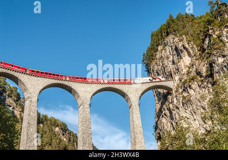 Express train at the Landwasser Viaduct in the Swiss Alps, Switzerland Stock Photo